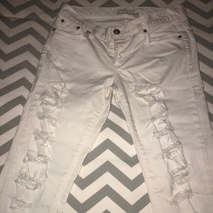 Distressed white jeans